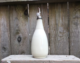 The Oil  or Vinegar Bottle white with a fancy pouring spout