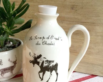 Jug for maple syrup. Moose design , French inscription "Le Pichet à Sirop du Chalet". Nice decorative pottery for your cottage