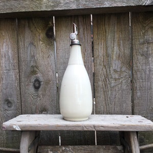 The Oil  or Vinegar Bottle white with a fancy pouring spout