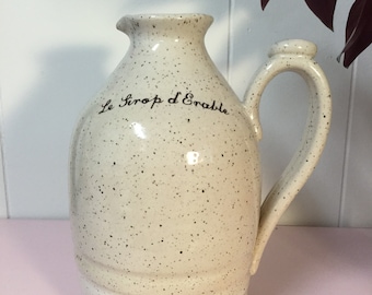 Jug for maple syrup with french or english inscription on beige stoneware pottery