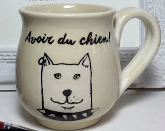 Funny dog cup with two different illustrated dogs.  made of hand-thrown porcelain clay