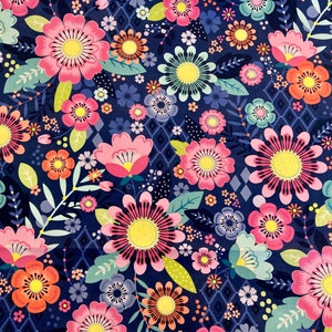 May include: A navy blue fabric with a floral pattern. The flowers are pink, orange, yellow, and green. The fabric has a geometric pattern in the background.