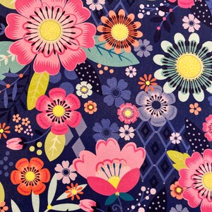 May include: A seamless pattern featuring a variety of colourful flowers on a dark blue background. The flowers are in shades of pink, red, orange, yellow, and blue. The pattern is perfect for fabric, wallpaper, or wrapping paper.