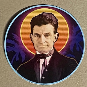 May include: A vintage-style sticker featuring a man in a suit and tie, with a retro sunset and palm trees in the background.
