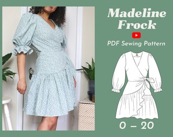 May include: A white wrap dress with a ruffled hem and long sleeves. The dress has a V-neckline and a tie at the waist. The dress is shown on a white background. The text "Madeline Frock" and "PDF Sewing Pattern" is shown above the dress. The text "0 - 20" is shown below the dress.
