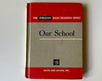 May include: A hardcover book titled Our School from The Sheldon Basic Reading Series by Allyn and Bacon, Inc. The cover features a red top and bottom border with a large gray central panel, black text, and a small black square logo with white letters.