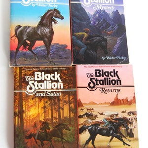 May include: Four paperback books with colorful covers featuring illustrations of black horses. The books are titled "The Black Stallion", "The Black Stallion Mystery", "The Black Stallion and Satan", and "The Black Stallion Returns". All books are by Walter Farley.