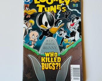 May include: A DC Looney Tunes comic book issue 75 featuring Daffy Duck with a magnifying glass, Porky Pig, Sylvester, and Tweety Bird. The cover shows a tombstone with the text R.I.P. BUGS BUNNY and the bold yellow title WHO KILLED BUGS?!