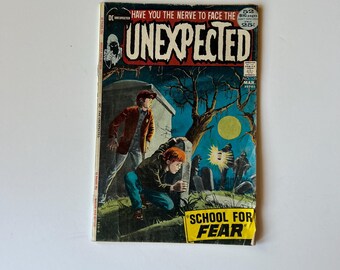 May include: A vintage DC Unexpected comic book, issue number 131, dated March. The cover features a dark, illustrated scene of two figures in a graveyard at night under a full moon, with the bold title text UNEXPECTED and SCHOOL FOR FEAR.