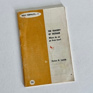 May include: A yellow pamphlet with the title "The Tragedy of Vietnam: Where do we go from here?" by Helen B. Lamb. The pamphlet is part of the "Basic Pamphlets" series and is numbered 17. The price is 10 cents.