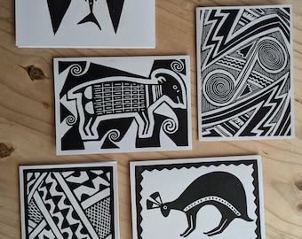May include: Five black and white greeting cards with different designs. The designs include a bird, a ram, a geometric pattern, a kangaroo, and a swirling pattern.