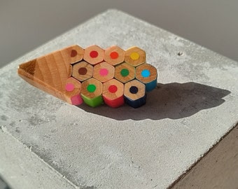 Multicolour pencil shape brooch handmade with recycled colouring pencils