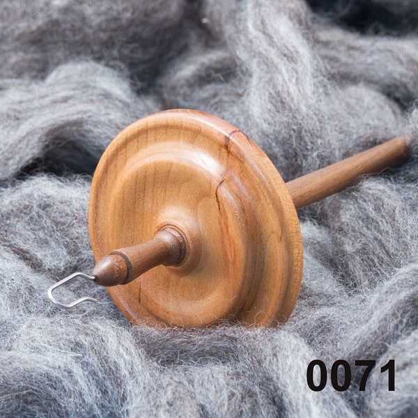 A hand made top whorl drop spindle