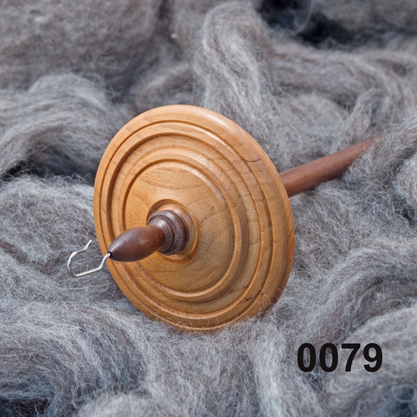 A hand made top whorl drop spindle