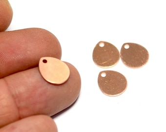 May include: Four rose gold metal teardrop shaped charms with a hole at the top for attaching to jewelry or other crafts.