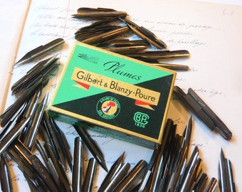 Boîte de 144 plumes Gilbert & Blanzy-Poure Boîte ouverte et complète de 144 plumes Caducée N 81 Plumes bronze Calligraphie Dessin Ecriture