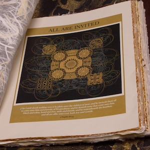 May include: Open book with the text "ALL ARE INVITED" in gold lettering. The page features a black background with gold and teal circular designs. The opposite page has a textured, fibrous appearance.