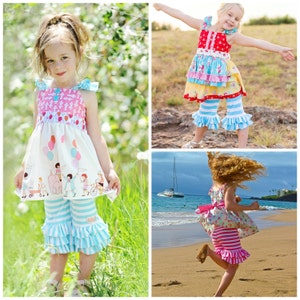 May include: Three young girls wearing different styles of summer dresses and matching striped ruffle-bottom pants. The girls are in different settings, one in a grassy field, one in a beach setting, and one in a more urban setting.