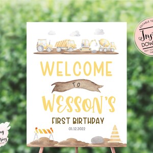 May include: Editable printable sign for a first birthday party with a construction theme. The sign is white with yellow text that says "Welcome to Wesson's First Birthday 01.12.2022". There are illustrations of construction vehicles and a construction zone.