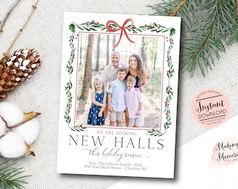 May include: A holiday card featuring a family photo framed by a watercolor design of green leaves, red berries, and a red bow. The text reads "We are decking New Halls this holiday season."