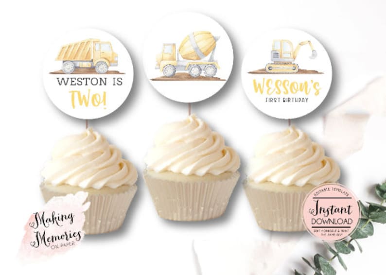 May include: Three cupcake toppers featuring yellow construction vehicles with the text "Weston is Two!" and "Wesson's First Birthday".