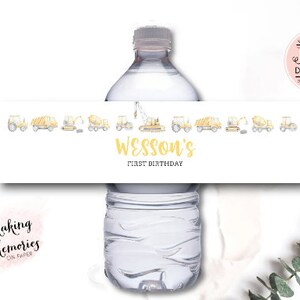May include: A white printable water bottle label with yellow construction vehicles and the text "Wesson's First Birthday".