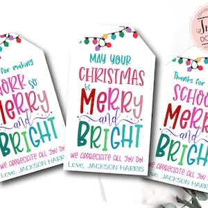 May include: White gift tags with colorful text that reads "Thanks for making WORK so MERRY and BRIGHT", "May your CHRISTMAS be MERRY and BRIGHT", and "Thanks for making SCHOOL so MERRY and BRIGHT". Each tag has a string of lights.