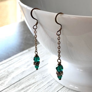 emerald Swarovski crystal and sterling silver dangling earrings image 1