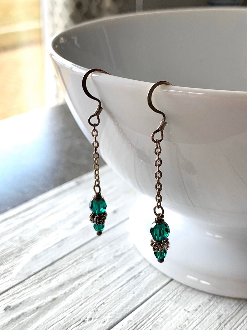 emerald Swarovski crystal and sterling silver dangling earrings image 1