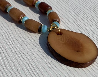 tagua necklace with gold and aqua accents