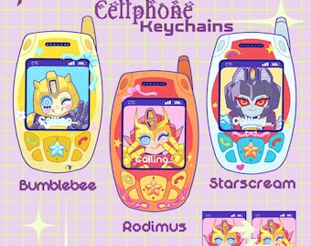 May include: Three Transformers cellphone keychains featuring Bumblebee, Rodimus, and Starscream. Each keychain displays a character on the screen with the text Calling. The designs include colorful buttons, antennas, and decorative bows on a grid background.