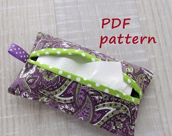May include: A purple and green paisley patterned tissue box cover with a white tissue inside. The cover has a green and white polka dot trim. The text "PDF pattern" is written in red above the tissue box cover.
