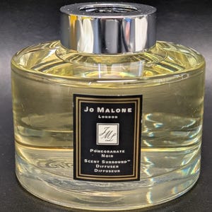 May include: A rustic wooden sign with the text "Welcome to our home" in white lettering. The sign features a distressed finish and a simple, inviting design, perfect for a front porch or entryway.