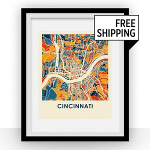 Puede incluir: Una impresión de mapa colorido de Cincinnati, Ohio, con fondo blanco y marco negro. El mapa está en un estilo retro con una mezcla de colores naranja, amarillo, rojo, azul y verde. El texto "CINCINNATI" está impreso debajo del mapa.