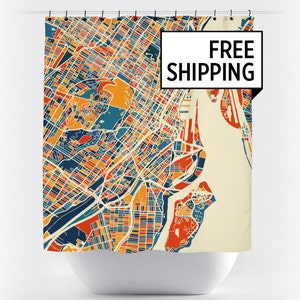 May include: A shower curtain featuring a colorful map of a city. The map is in a retro style with a cream background and bright orange, red, blue, and yellow colors. The text "FREE SHIPPING" is in a white box with a black border.