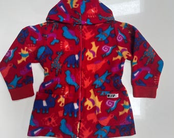 May include: A red fleece zip-up jacket with a hood, featuring a colorful all-over print of various animals in blue, yellow, and purple. The jacket includes long sleeves with ribbed cuffs, two front pockets, and a small white label reading AVA.