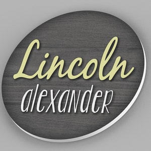 custom round name sign with wood background and first and middle name