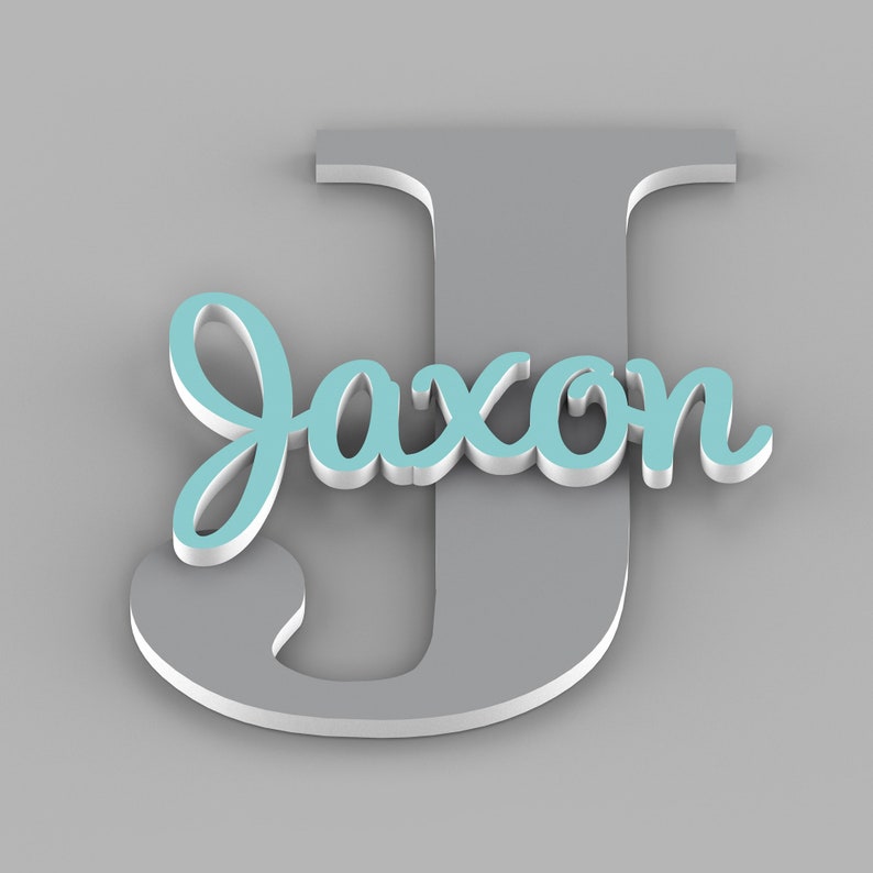 May include: A gray wooden letter J with the name Jaxon written in light blue cursive letters on top of it.