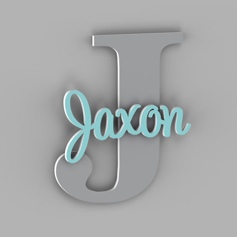 May include: A gray wooden letter J with the name Jaxon in light blue cursive lettering.