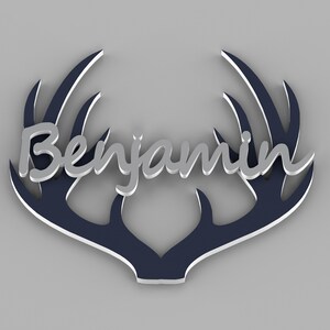 May include: A navy blue wooden antler design with the name "Benjamin" in silver lettering.