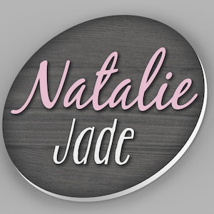 custom round name sign with wood background and first and middle name