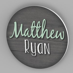 custom round name sign with wood background and first and middle name
