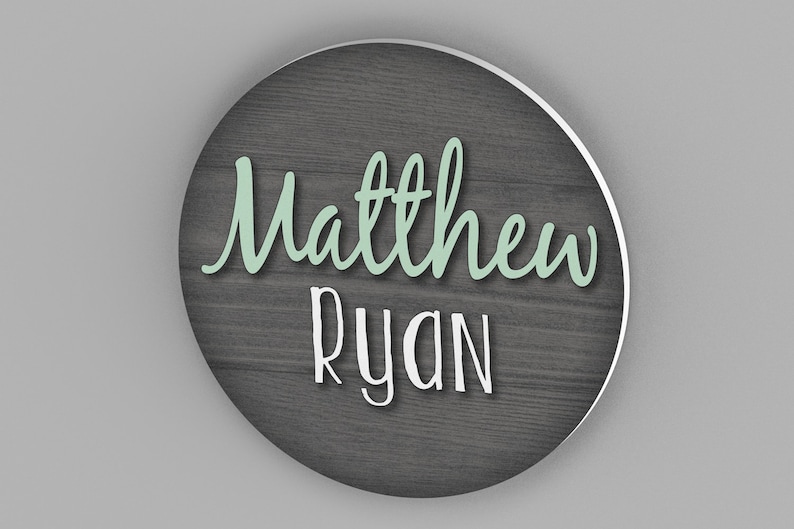 custom round name sign with wood background and first and middle name