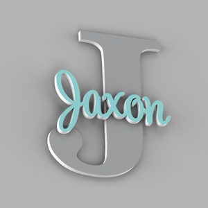 May include: A gray wooden letter J with the name Jaxon in light blue cursive lettering.