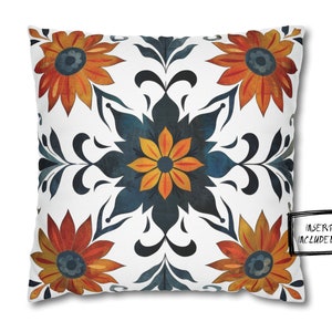 May include: A white throw pillow with a blue, orange, and yellow floral pattern. The pillow has a square shape and a white background. The floral pattern is symmetrical and features stylized flowers and leaves. The text "INSERT INCLUDED!!" is printed in black on a white rectangle in the lower right corner of the pillow.