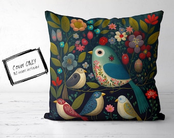 May include: A dark blue pillow cover with a floral design featuring colorful birds. The birds are surrounded by flowers and leaves in shades of red, pink, blue, and green.