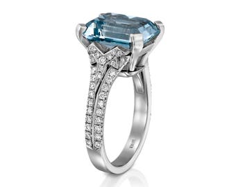 Anillo de compromiso de color aguamarina y diamantes Diseño Starburst, oro de 18 quilates