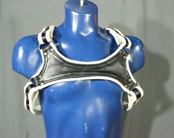Black and white leather harness with keystone highlight.