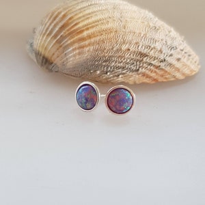 Stud earrings in pretty purple fire  opal stud earrings in 925 silver with butterfly fittings,