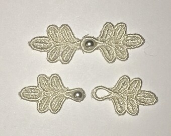 Small Frog Closures 1 3/4", pkg of 2. #R44 Eggshell. Machine Embroidered.